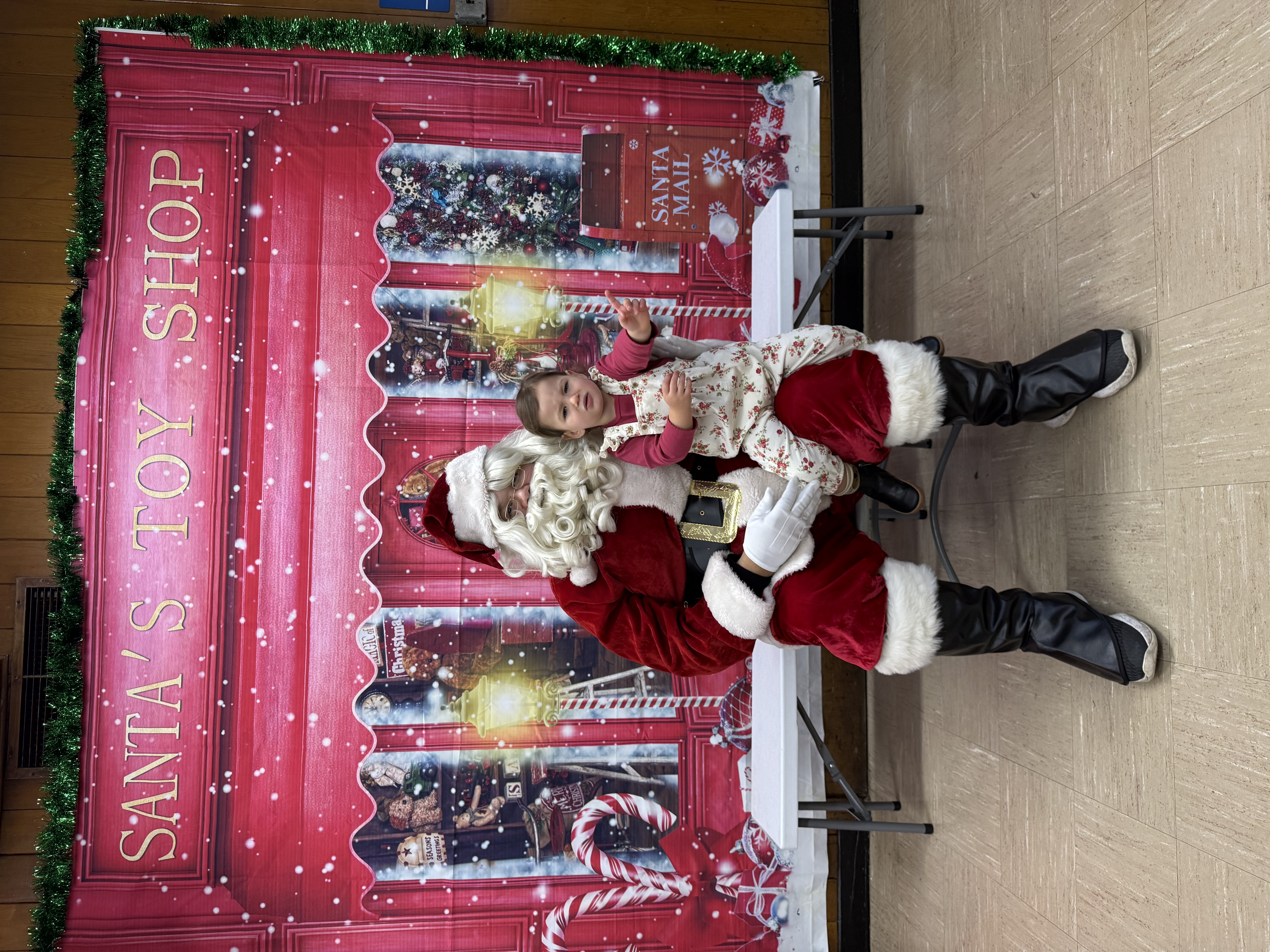 A photograph of a baby with Santa.